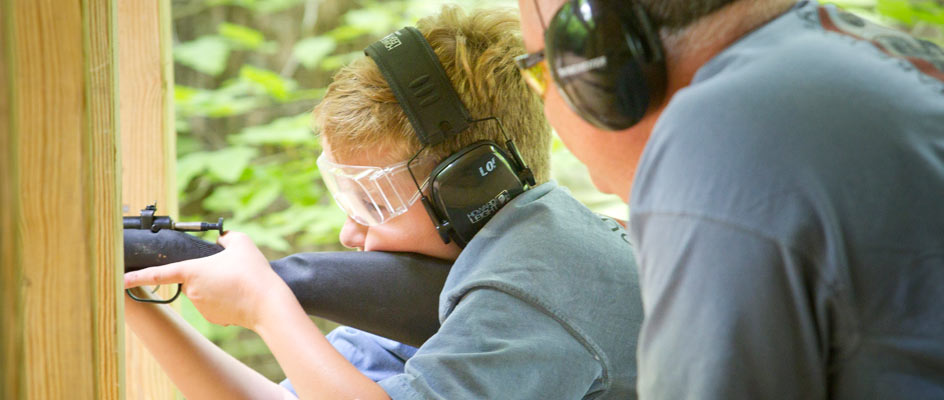 A-father-teaching-his-son-riflery