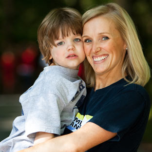 Melissa pauses during the summer with one of her boys.
